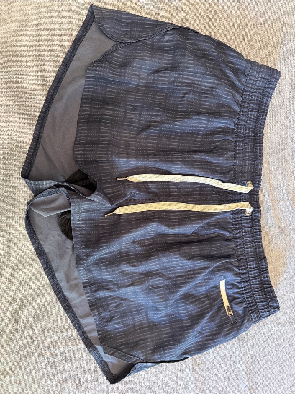 Vuori Women's Black Athletic Shorts with Cream Drawstrings